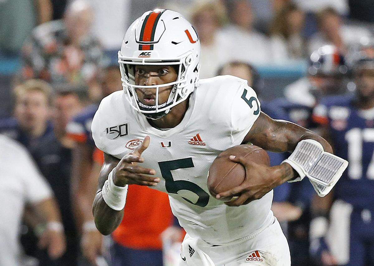 Miami Hurricanes quarterback N’Kosi Perry scores against Virginia at Hard Rock Stadium on Friday, October 11, 2019.