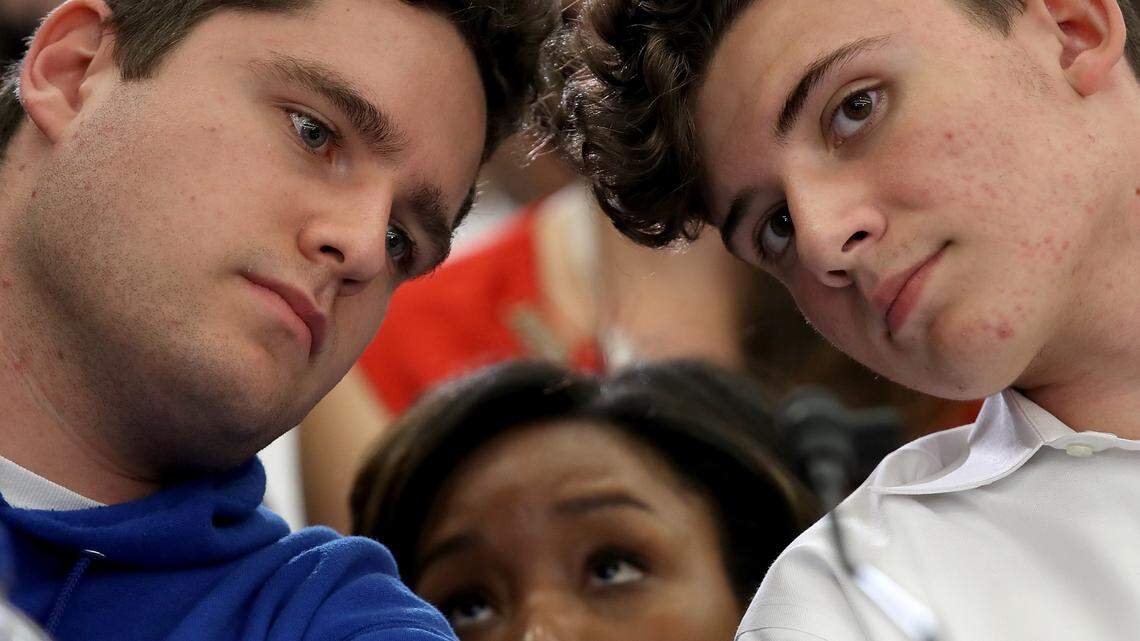 Charlie Mirsky, left, and Alfonso Calderson, students at Marjory Stoneman Douglas High School in Parkland, Florida, confer during a forum with the Gun Violence Task Force on Capitol Hill Wednesday, May 23, 2018, in Washington, DC. Students from schools across the nation met and spoke with Democratic members of the House to discuss recent school shootings and gun violence in inner city neighborhoods.