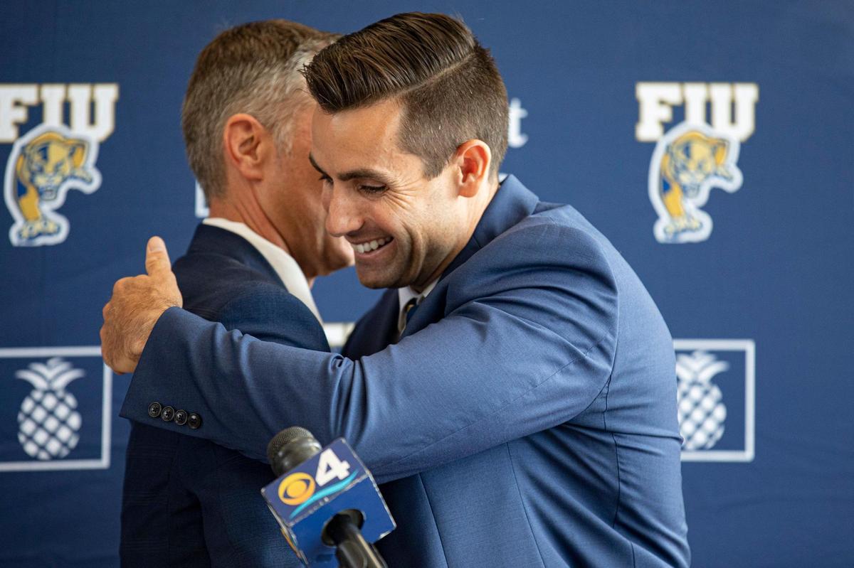 FIU Athletics Director Scott Carr (left) greets newly appointed FIU Baseball Coach Rich Witten on Monday, June 27, 2022 at the FIU Baseball Stadium in Miami, Fla.