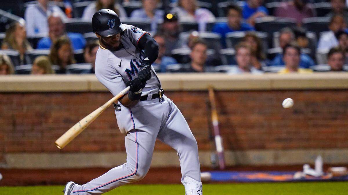 Miami Marlins’ Bryan De La Cruz hits a double against the New York Mets during the seventh inning of a baseball game Friday, July 8, 2022, in New York. (AP Photo/Frank Franklin II)