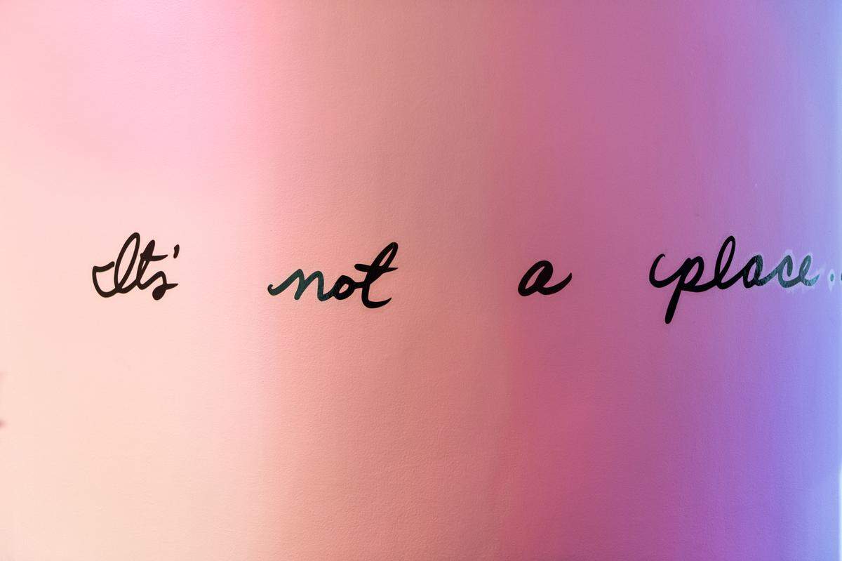 Lyrics from ‘XXX’ by Kendrick Lamar are printed on the walls of ‘Good Times,’ an art exhibition at Oolite Arts.