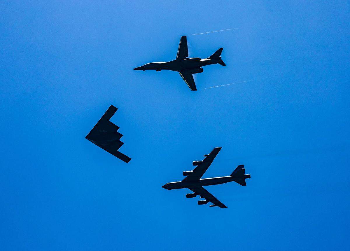 A U.S. Air Force Tri-Bomber formation—featuring the Northrop B-2 Spirit (center), a B-1 Lancer (top), and a B-52 Stratofortress—flies over South Beach during the Hyundai Air & Sea Show as part of Miami Beach’s annual National Salute to America’s Heroes on Saturday, May 24, 2025.