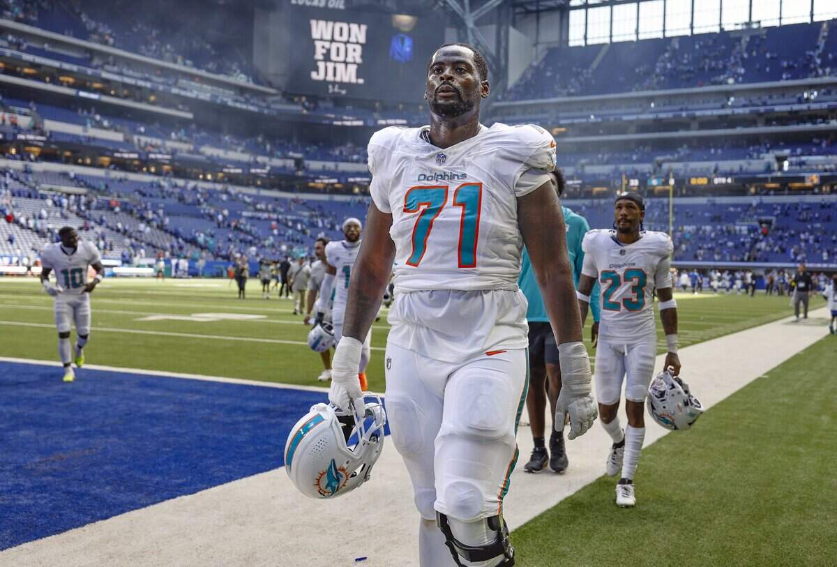 Miami Dolphins offensive tackle Kion Smith (71) walks off the field after the Indianapolis Colts defeat the Dolphins 33-8 in an NFL game at Lucas Oil Stadium in Indianapolis on Sunday, September 7, 2025, in Indianapolis.