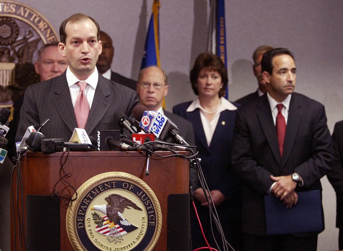 In 2006, Miami U.S. Attorney Alexander Acosta, left, spoke to the media about the arrests of seven terror suspects in Liberty City. A new documentary argues the case was an example of government overreach in the wake of 9/11.