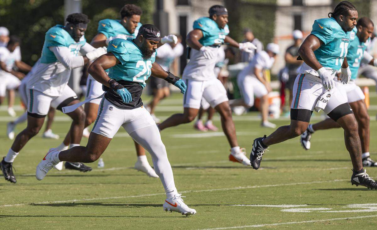 Miami Dolphins linebacker Jordyn Brooks (20) runs drills during training camp at the Baptist Health Training Complex on Tuesday, July 29, 2025, in Miami Gardens, Fla.
