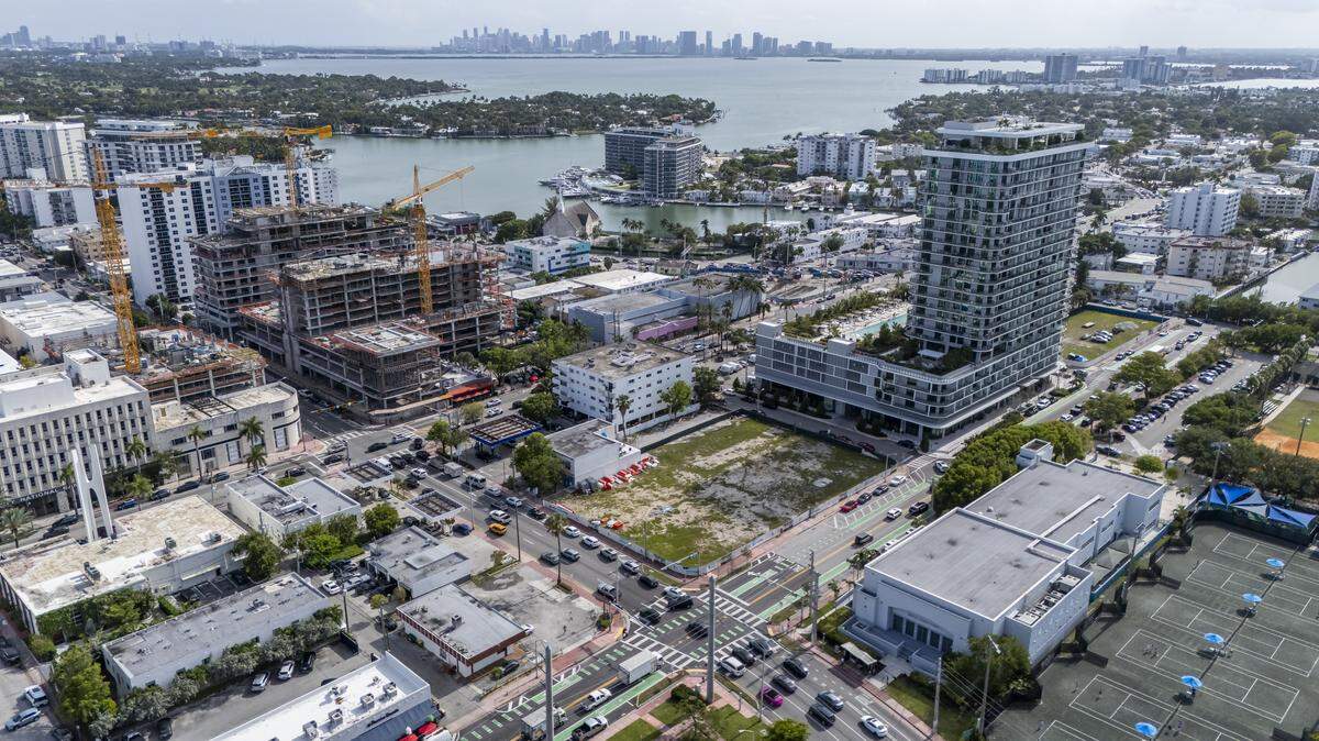 Cars make their way past a construction development at 71 NoBe, top left, in North Miami Beach on Tuesday, May 5, 2026, in Miami Beach, Fla.