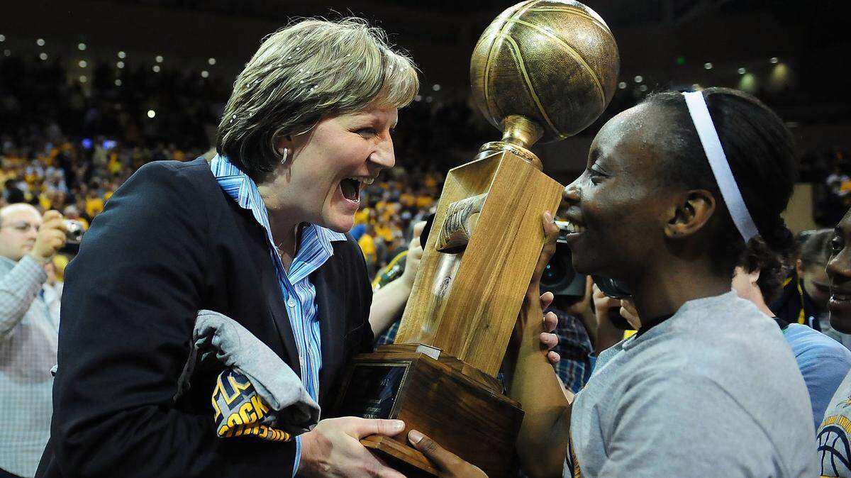 April 2, 2011; Toledo, OH, USA; Toledo Rockets head coach Tricia Cullop celebrates with Toledo Rockets guard Jessica Williams (right) after defeat the USC Trojans 76-68 to win the WNIT championship game at Savage Arena. Mandatory Credit: Andrew Weber-USA TODAY Sports