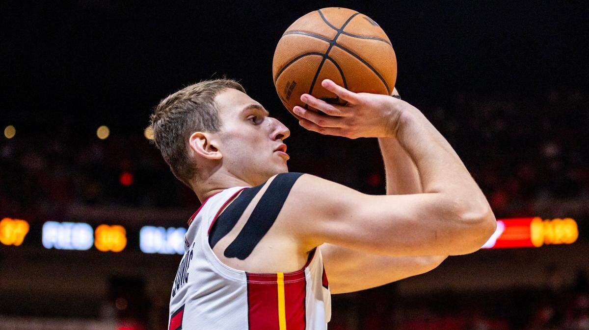 Miami Heat forward Nikola Jovic (5) shoots a three-pointer during the second half of an NBA game against the Raptors at Kaseya Center in Miami on April 12, 2024.