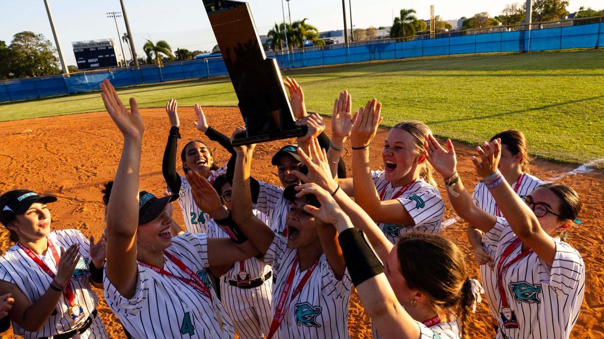 Coral Reef Senior High School Softball players react to winning the GMAC softball championship game 15-0 against Palmetto High School at South Dade High School on Thursday, April 17, 2025, in Miami, Fla.