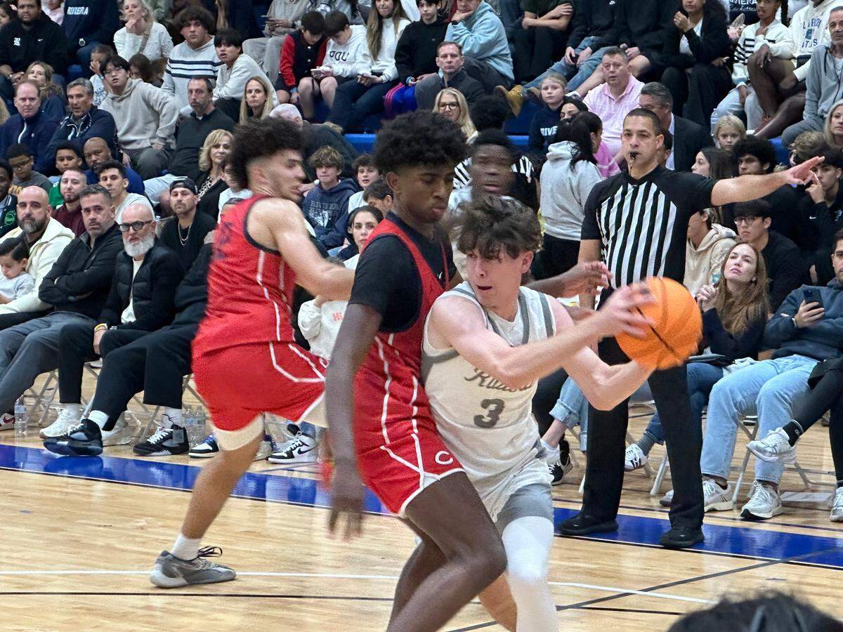 Riviera Prep guard Matthew Casey looks for an open teammate during the Bulldogs’ game against Columbus on Friday, Jan. 10, 2025 at the Miami-Dade Kendall campus gym.