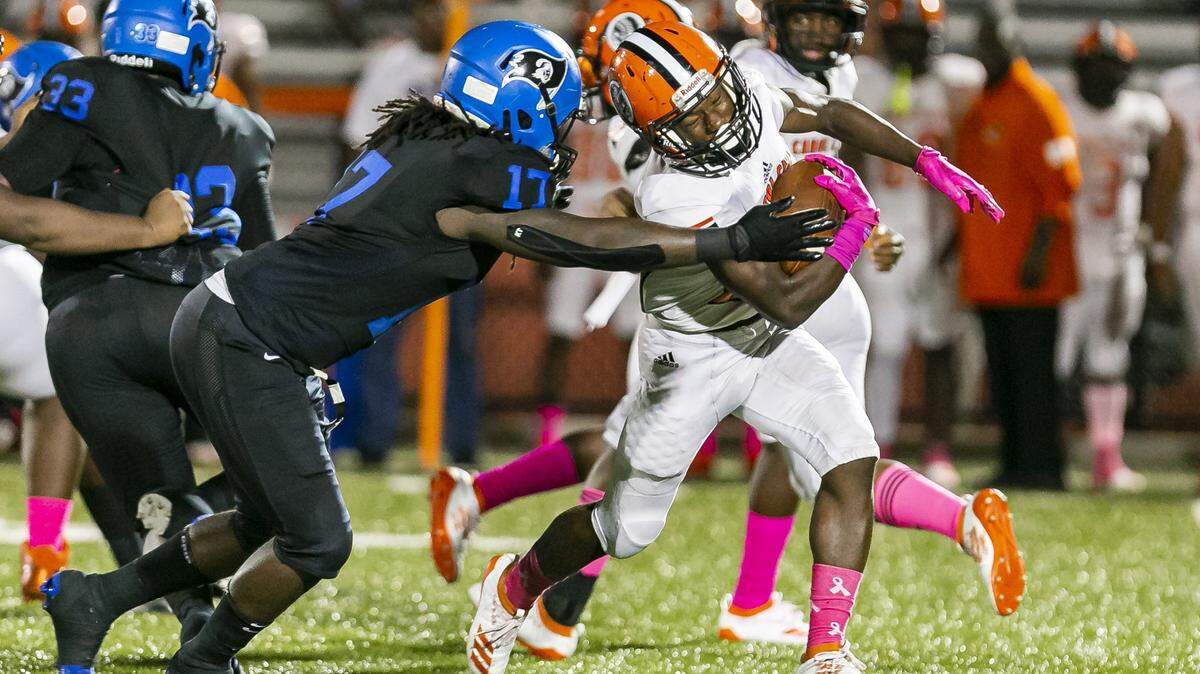 South Dade linebacker Tarod Snead (17) sacks Carol City Duane Thomas Jr. (20) in the first quarter of a high school football game at Harris Field Park in Homestead, Florida on Friday, October 18, 2019.