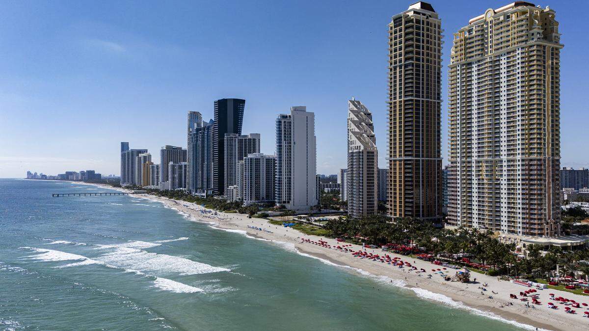 An aerial view of the (from right to left) Acqualina Ocean Residences, Mansions at Acqualina Residences and the Pinnacle Condo and the Chateau Beach Condo as they sit near the coastline on Friday, Oct. 31, 2025, in Sunny Isles Beach, Fla.