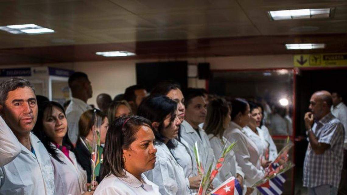 Cuban doctors assemble to meet Cuba’s President Miguel Diaz-Canel after landing in Havana on Nov. 23. They are among the first group to leave Brazil after the medical program was suspended.