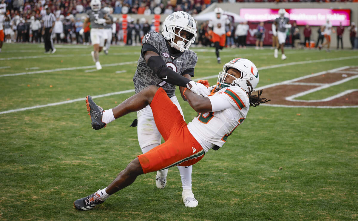 Miami Hurricanes wide receiver Malachi Toney (10) catch the final touchdown pass to seal the game as Virginia Tech Hokies cornerback Isaiah Brown-Murray (9) defends in the second half at Lane Stadium in Blacksburg, Virginia, on Saturday, November 22, 2025.