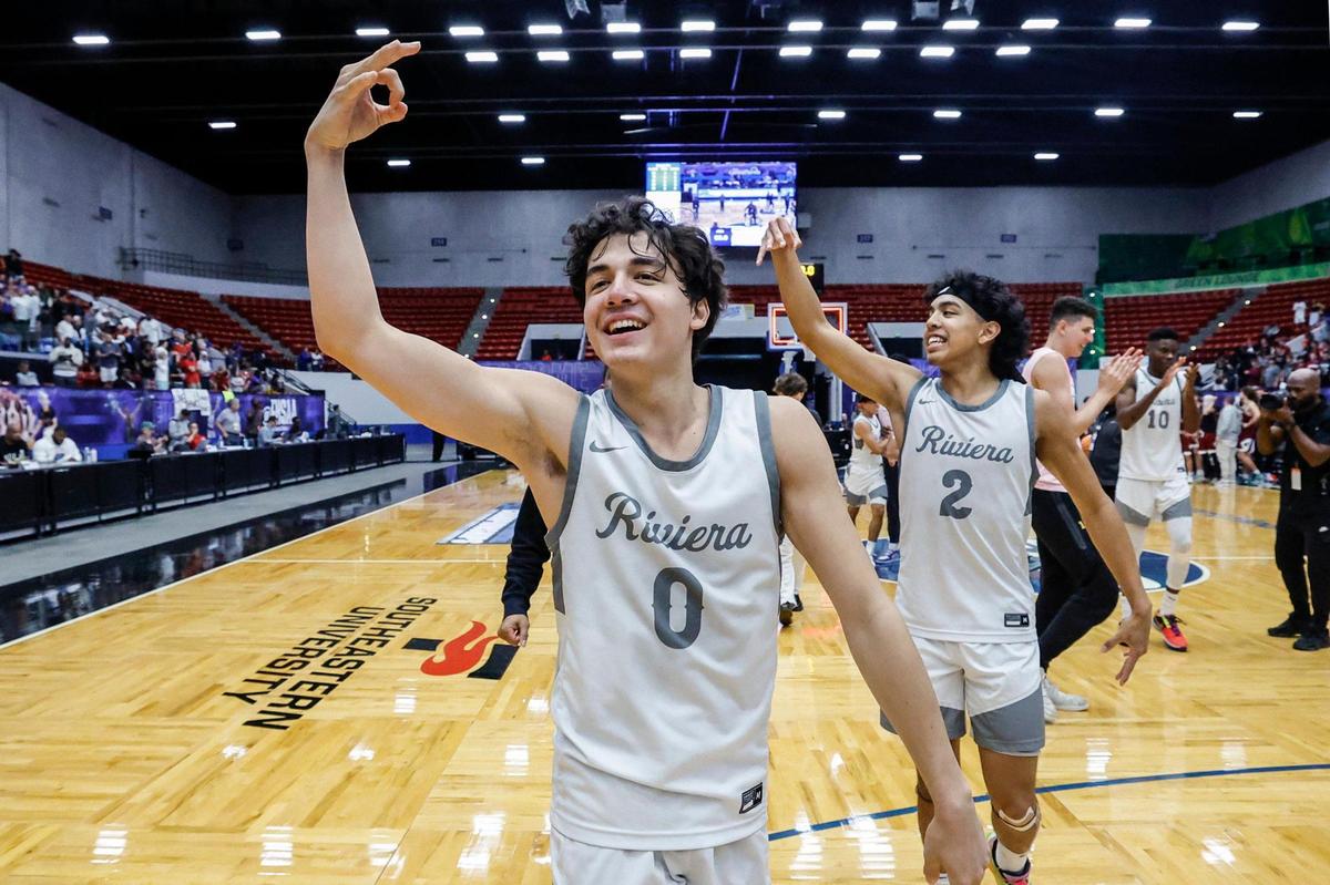 Riviera Prep’s Myles Fuentes (0) and brother Mason Fuentes (2) celebrate after the team defeated Santa Fe Catholic for the FHSAA Class 2A Boys High School Basketball State Championship at the RP Funding Center in Lakeland, Florida on Saturday, March 1, 2025.