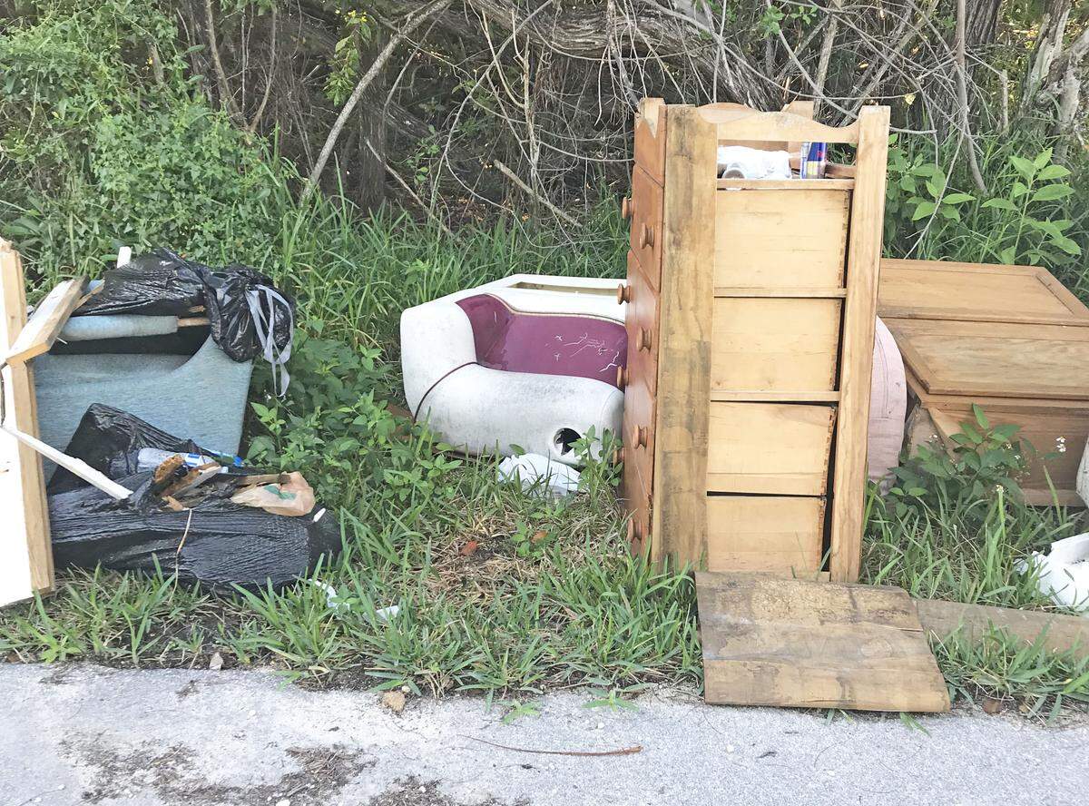Illegal dumping, such as this collection of trash on the side of a road, has increased since the year before Hurricane Irma.