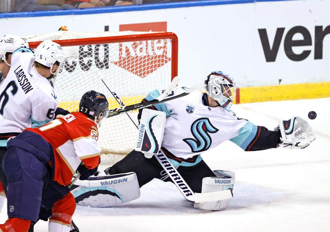 Seattle Kraken goaltender Chris Driedger (60) stop a shot against the Florida Panthers during the first period of an NHL game at the FLA Live Arena on Saturday, November 27, 2021 in Sunrise, Fl.