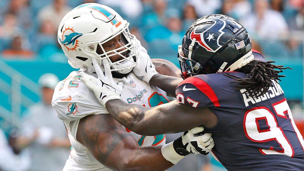 Miami Dolphins offensive tackle Terron Armstead (72) blocks Houston Texans defensive end Mario Addison (97) in the first quarter at Hard Rock Stadium in Miami Gardens on Sunday, November 27, 2022.