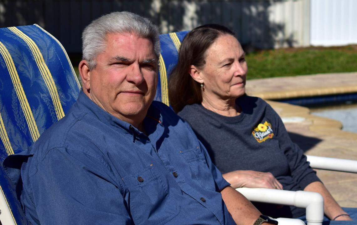 Louis Minardi and Raye Ellen Minardi sit by their pool on Gunn Highway in Odessa, Florida, on Jan. 29, 2023. The gun-shaped pool was not their idea. Instead, the builder was inspired by Minardi’s previous job as a gunsmith, Minardi said.