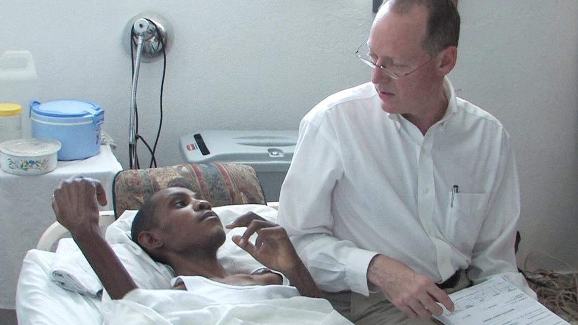 Dr. Paul Farmer, above, treats a patient at a clinic in Cange, Haiti, in this file photo. Farmer began his lifelong commitment to Haiti in 1983 while still a student working with dispossessed farmers in Haiti’s Central Plateau. 