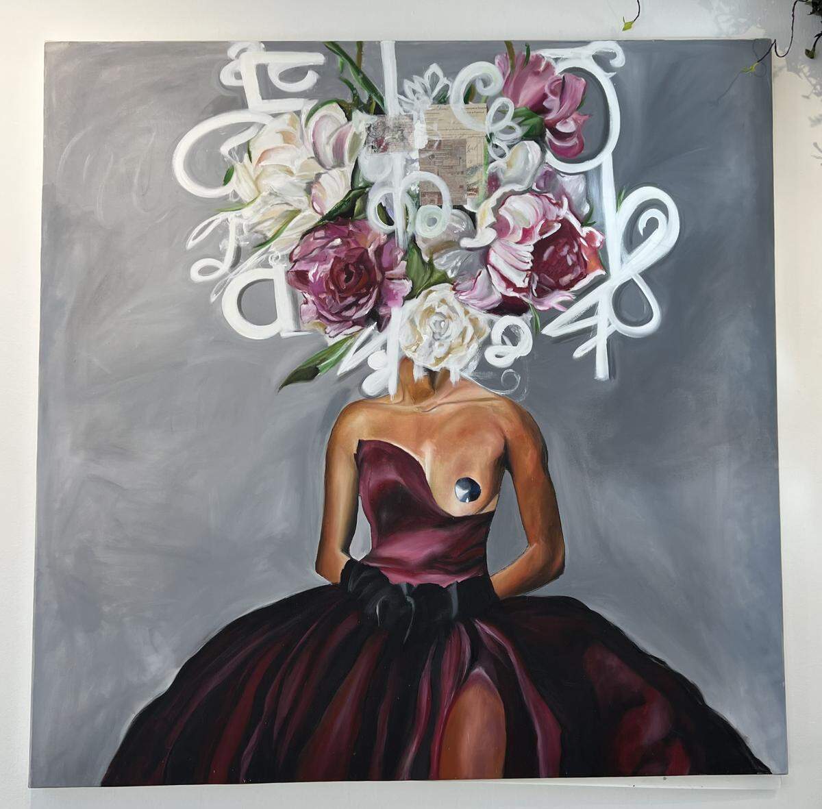 In this piece entitled “Majaste,” Magdala Charles portrays a faceless woman wearing a flower crown atop her head a deep mauve dress with a singular breast exposed. Her work is a part of an exhibit, La Couronne Des Fleurs at the Little Haiti Cultural Center. It runs through November 22.