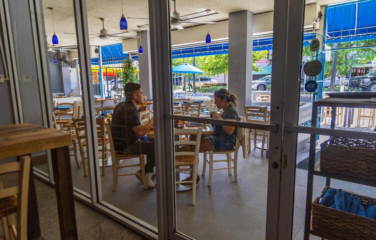 Patrons eat on the porch at the The Greek Joint on Hollywood Boulevard, where many businesses are benefiting as a result of the upgrades brought by the Hollywood Boulevard StreetScape Improvement Project. That includes the reconstruction of Hollywood Boulevard from 21st Avenue to Young Circle while maintaining the existing center median with its extensive tree canopy and diagonal parking spaces, on Tuesday November 7, 2023.