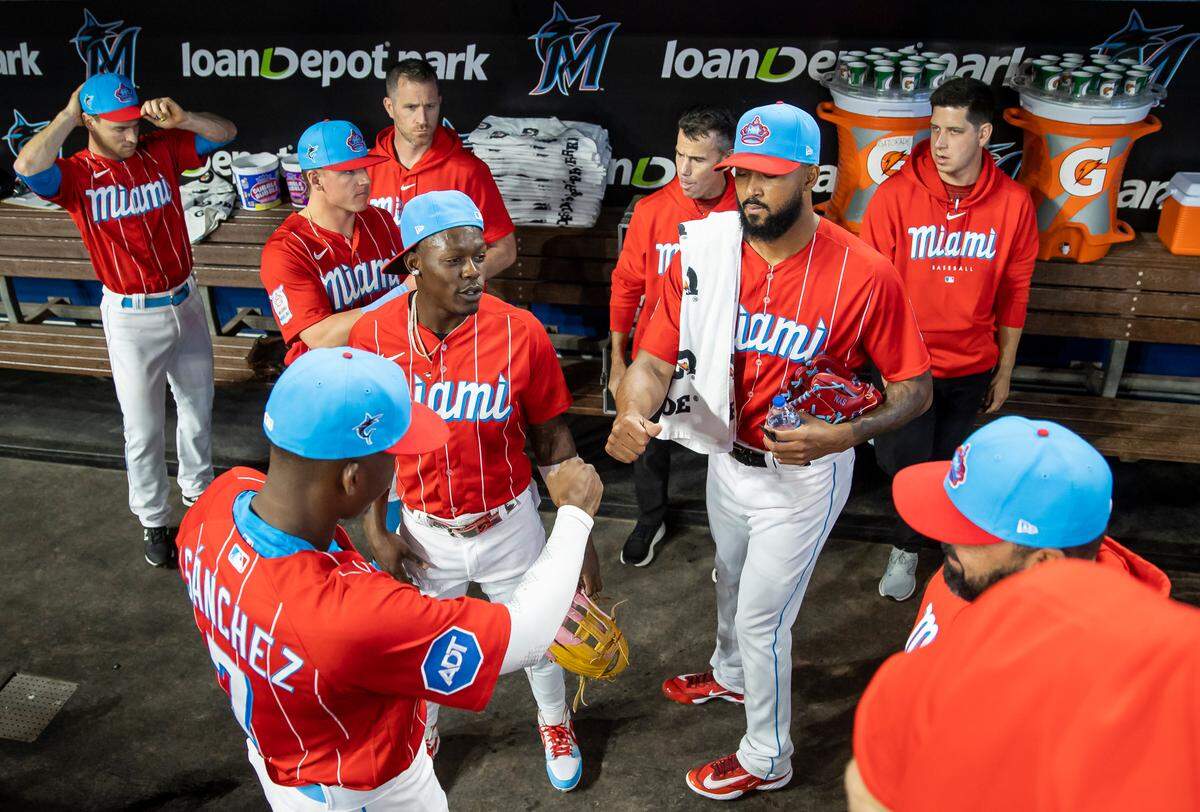Miami Marlins starting pitcher Sandy Alcantara (22) greets right fielder Jesus Sanchez (7) before the start of their MLB game against the Cincinnati Reds at loanDepot park on Saturday, May 13, 2023, in Miami, Fla.