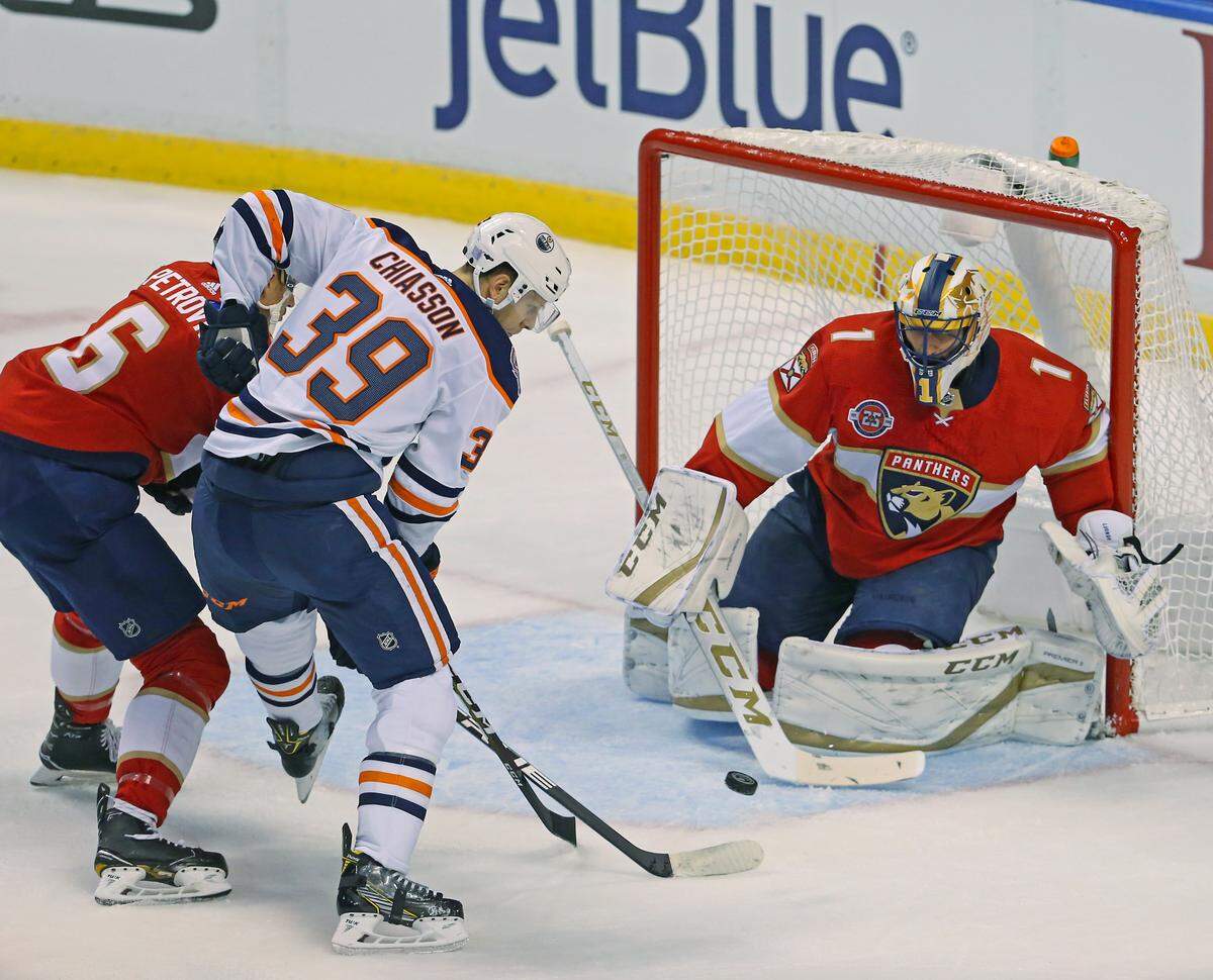 Florida Panthers goalie Roberto Luongo (1) blocks a shot by Edmonton Oilers right wing Alex Chiasson (39) during the first period of an NHL regular season hockey game at the BB&T Center on Thursday, November 8, 2018 in Sunrise.