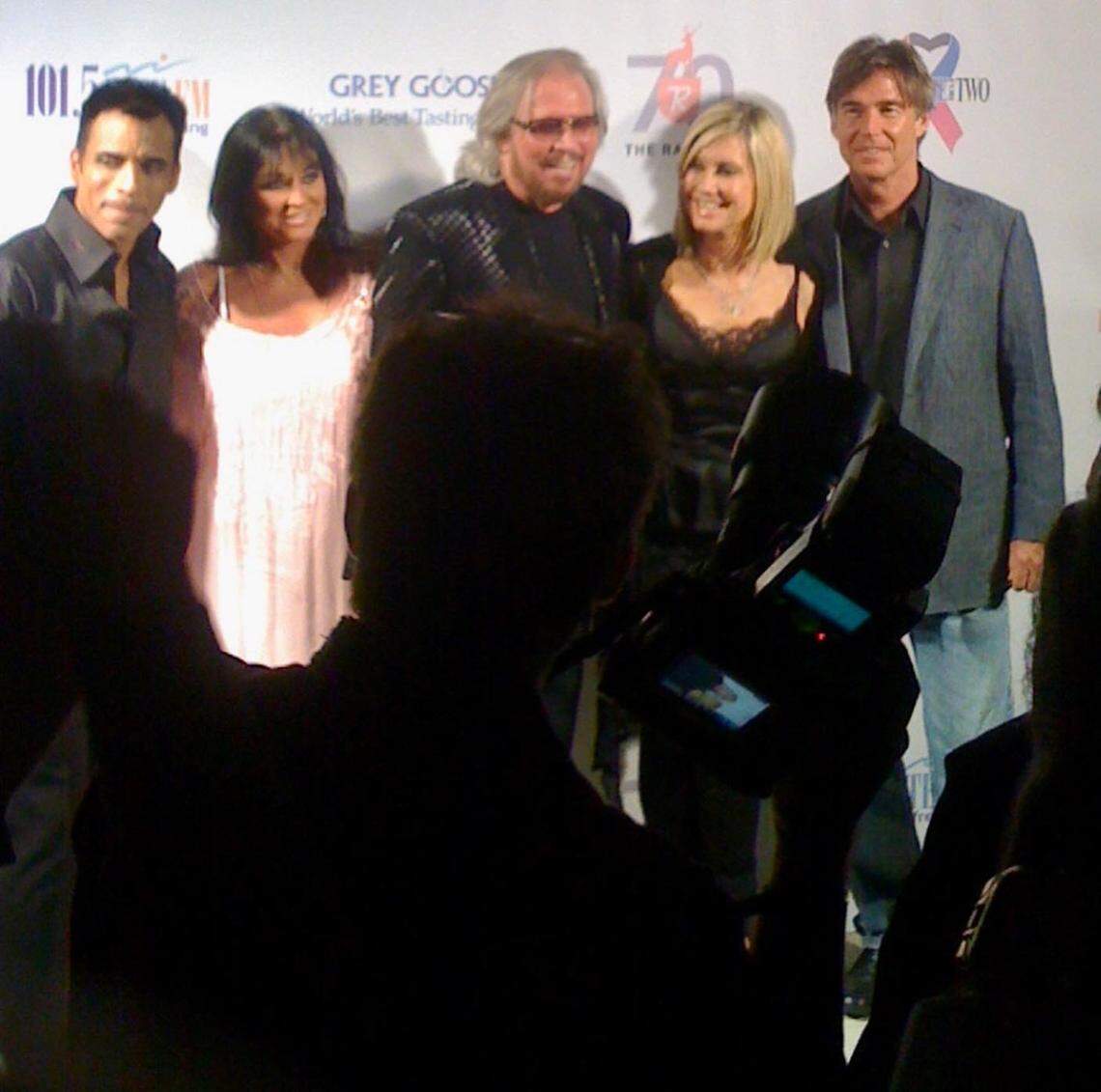 Jon Secada, Linda Gibb, Barry Gibb, Olivia Newton-John and her husband John Easterling on the red carpet at The Raleigh Hotel in Miami Beach on April 22, 2010. Newton-John, Secada and Barry Gibb performed a cancer charity benefit, Pink and Blue for Two, at the hotel that evening.