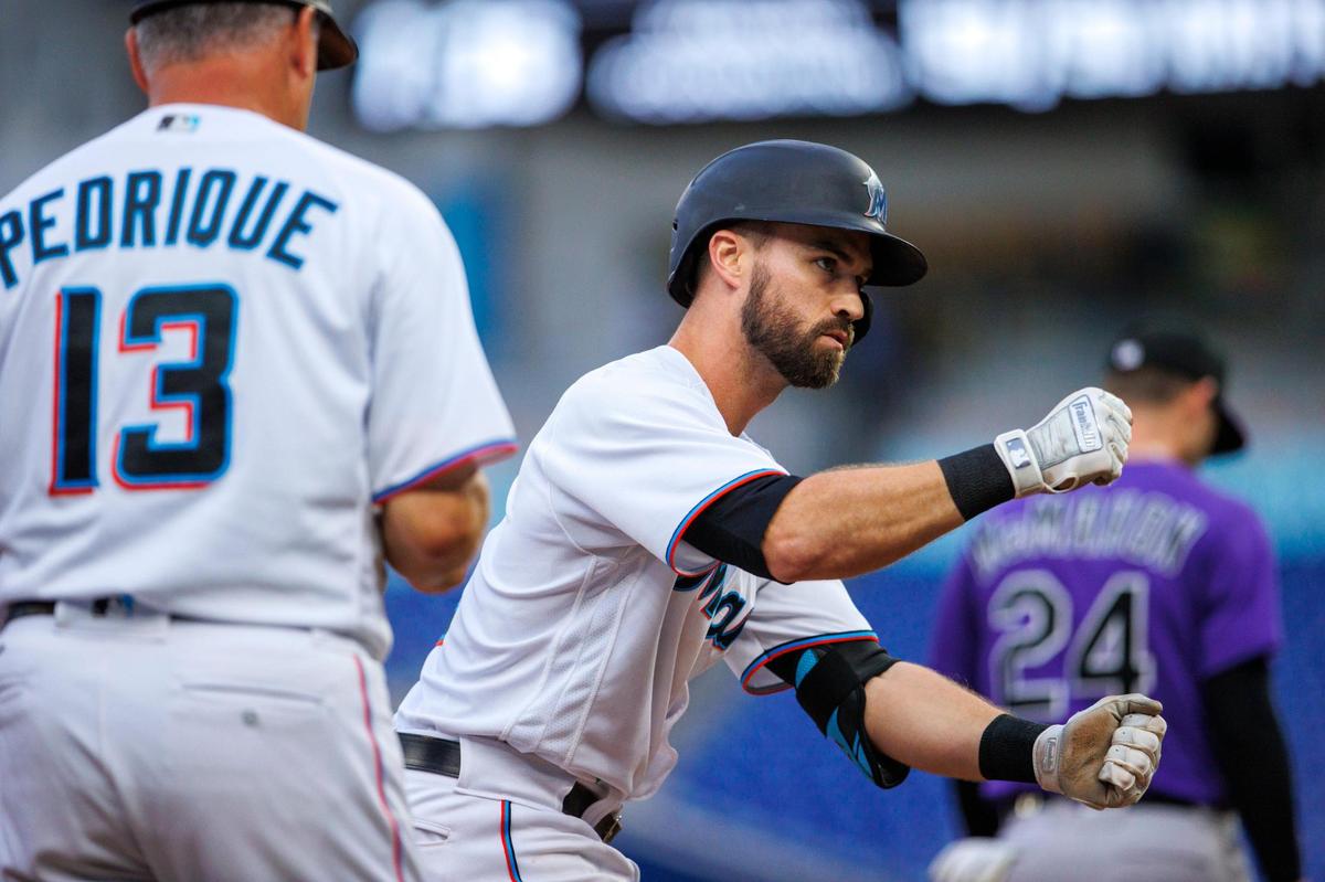 Miami Marlins third baseman Jon Berti (5) reacts after hitting a RBI triple during the third inning of a baseball game against the Colorado Rockies at LoanDepot Park on Wednesday, June 22, 2022 in Miami, Florida.