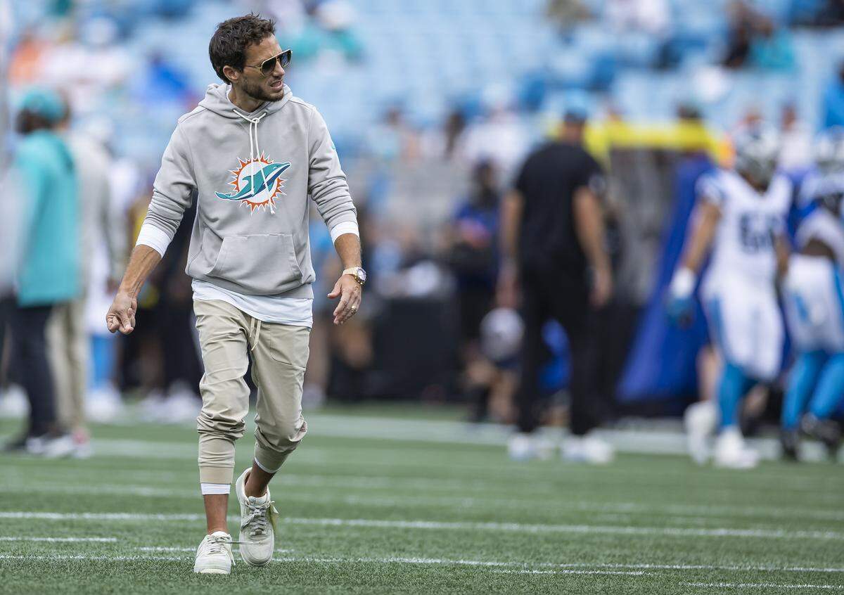 Miami Dolphins head coach Mike McDaniel watches his team warm up before their NFL game against the Carolina Panthers at the Bank of America Stadium on Sunday, Oct. 5, 2025, in Charlotte, N.C.