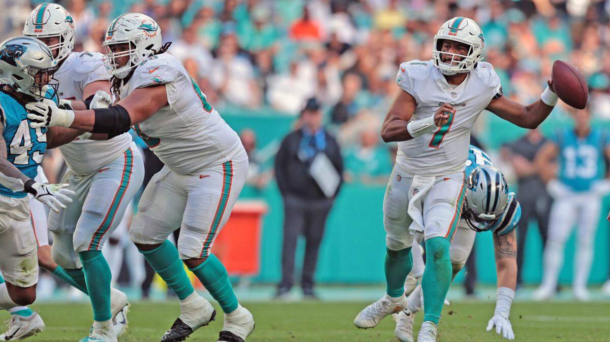 Miami Dolphins quarterback Tua Tagovailoa (1) scrambles in the fourth quarter against the Carolina Panthers at Hard Rock Stadium on Sunday, November 28, 2021.