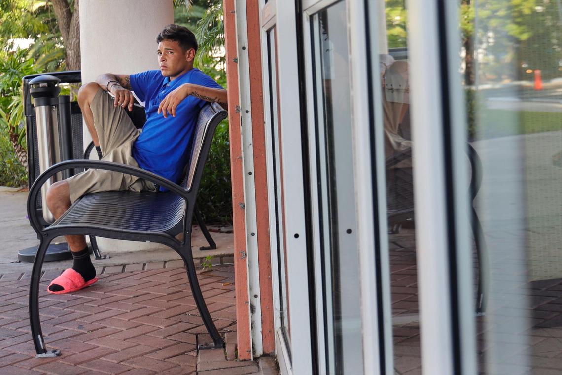 Pedro Escalona ponders his next move while waiting to get his check cashed by his former employer on Monday, Oct. 10, 2022. He and other Venezuelan migrants were recruited from a shelter in New York to work on Hurricane Ian clean up in Fort Myers.