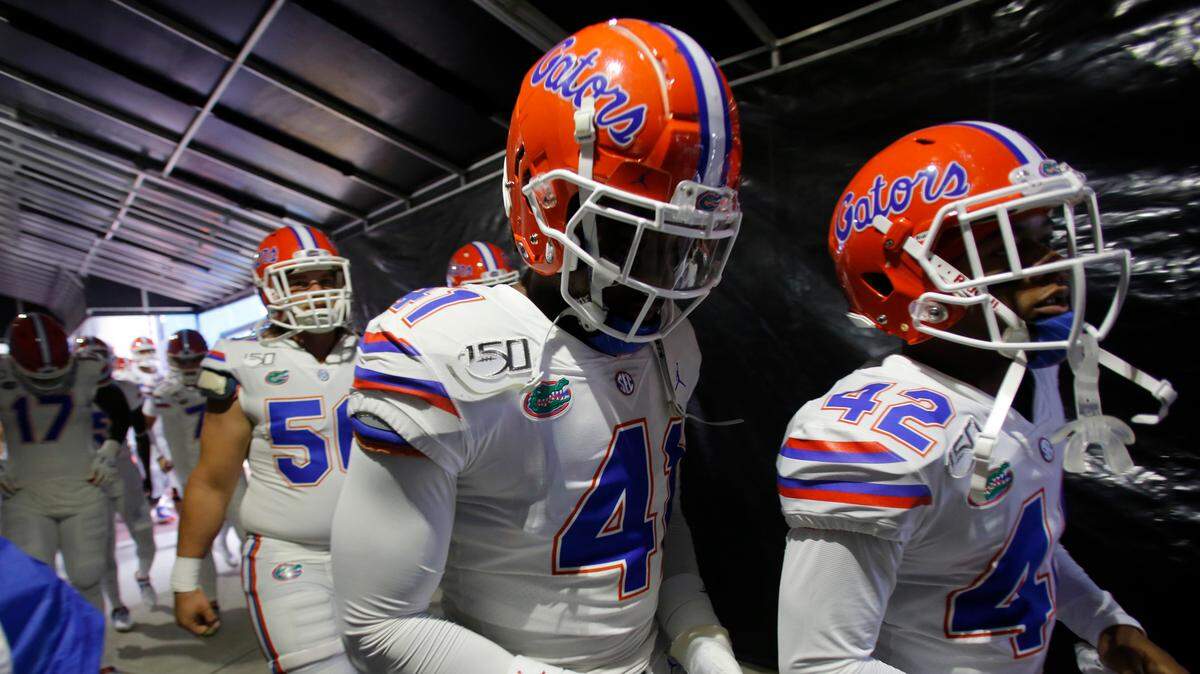 Florida’s James Houston IV (41) and Umstead Sanders (42) jog through the tunnel before the start of the NCAA college football game against South Carolina Saturday, Oct. 19, 2019, in Columbia, SC.