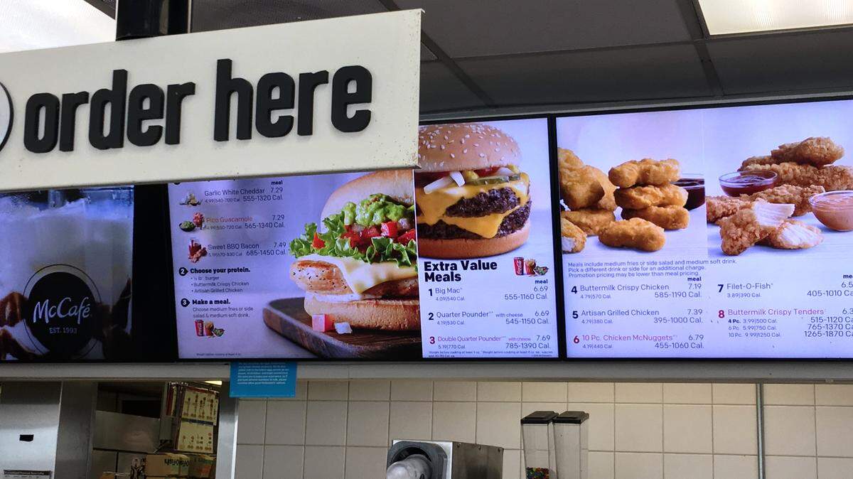 The McDonald's menu board at a Doral location on Southwest 87th Avenue shows a Quarter Pounder with Cheese as one of the selections on May 22, 2018.