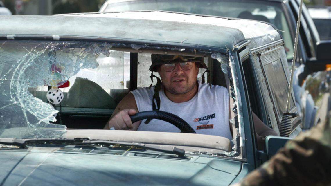 In 2004, a Florida driver on the road with a broken windshield after Hurricane Charley.