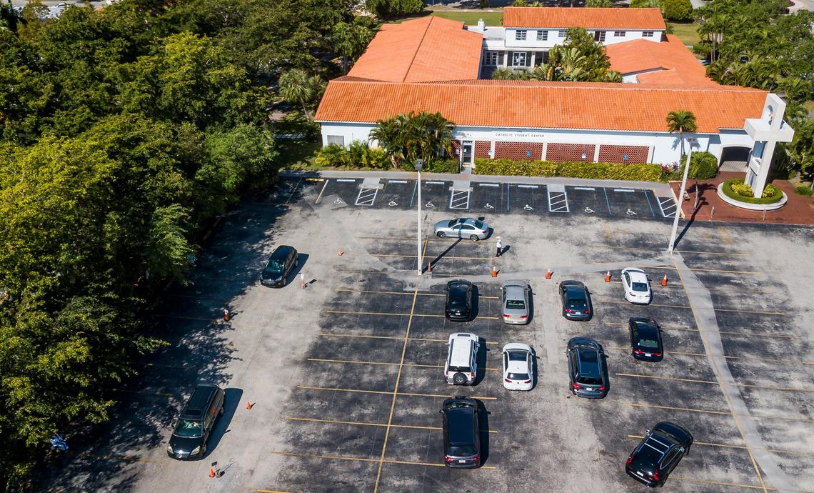 Cars line up for a drive-thru confession with a priest at St. Augustine Church in Coral Gables, Florida on Saturday, March 21, 2020. Due to COVID-19, churches have had to use technology and different ideas to help reach their parishioners.