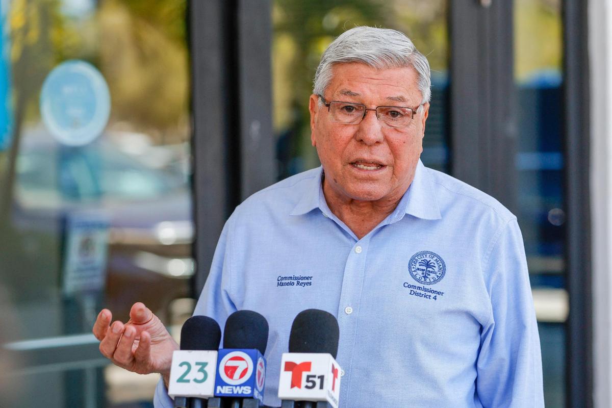 Miami Commissioner Manolo Reyes talks to reporters outside City Hall as City of Miami police officers investigate a possible break-in at the commissioner’s office in Coconut Grove, Florida, on Monday, Feb. 27, 2023.