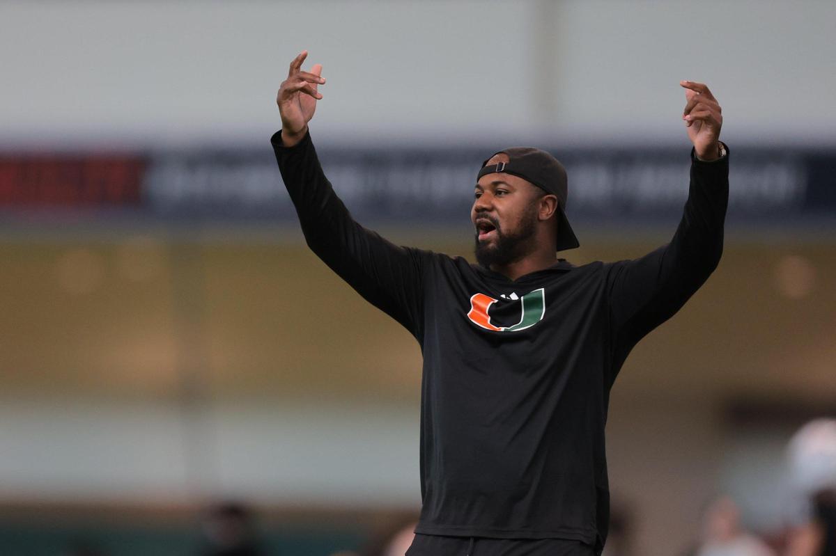 Miami Hurricanes defensive backs coach Zac Etheridge calls his players during spring practice at the Carol Soffer Indoor Practice Facility at the University of Miami in Coral Gables, Florida, Tuesday, April 1, 2025.