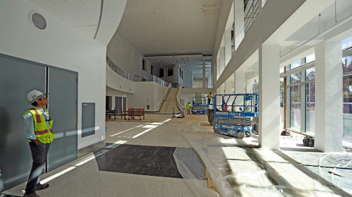 Work at the Miami Beach Convention Center on Tuesday, August 8, 2017. The convention center is expected to open in September.
