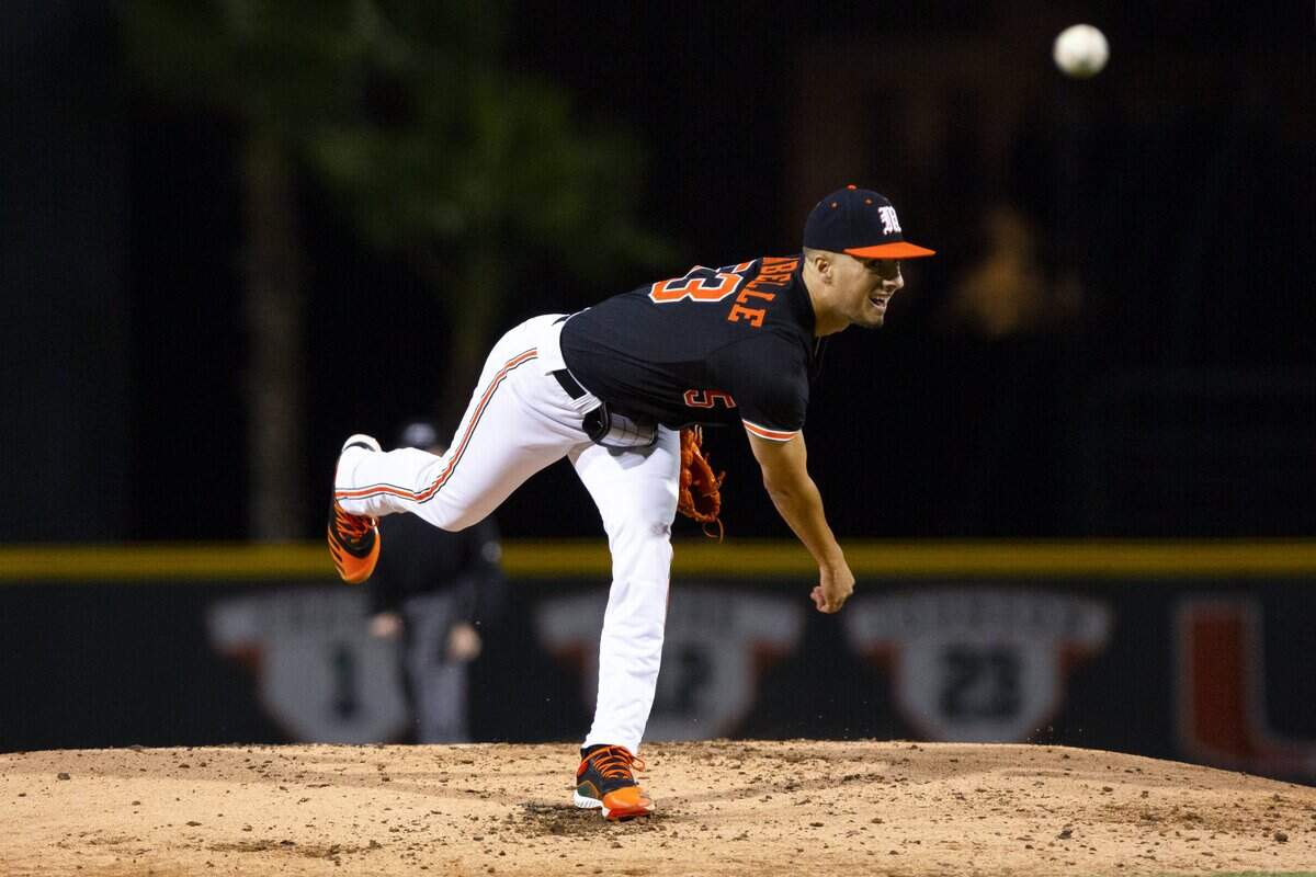 Miami Hurricanes right-handed pitcher Brian Van Belle (53) throws a pitch during the third inning of a baseball game against University of Florida at Alex Rodriguez Park in Coral Gables, Florida on Friday, February 21, 2020.