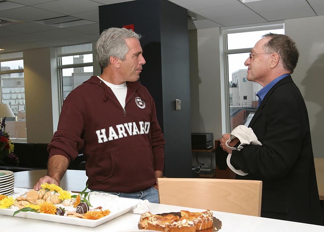 Once a friend of presidents, the ultra-rich and the elite of Wall Street’s bankers — plus a major benefactor to Harvard University — Jeffrey Epstein handled portfolios estimated to be worth over $15 billion. Then he became ensnared in a scandal involving the sexual abuse of underage girls. He is seen here, pre-scandal, at left, in conversation with Alan Dershowitz, one of America’s best-known legal experts and a Harvard Law professor emeritus, at a Cambridge event. Dershowitz became a key member of Epstein’s legal team.