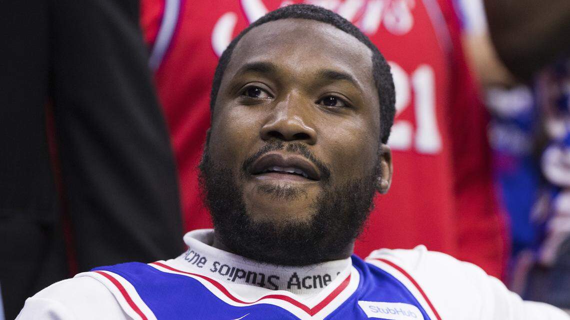 Rapper Meek Mill looks on during the first half in Game 5 of a first-round NBA basketball playoff series between the Miami Heat and the Philadelphia 76ers, Tuesday, April 24, 2018, in Philadelphia. The 76ers won 104-91.