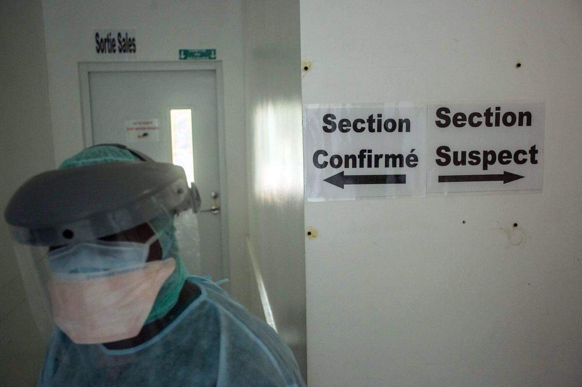 Dr. Erneau Mondesir walks in the corridors of the Doctors Without Borders Drouillard Hospital in Cite Soleil, Haiti, on June 3, 2020. “The illness is real. Many of our citizens are experiencing respiratory symptoms and other tell-tale signs,” said Mondesir.