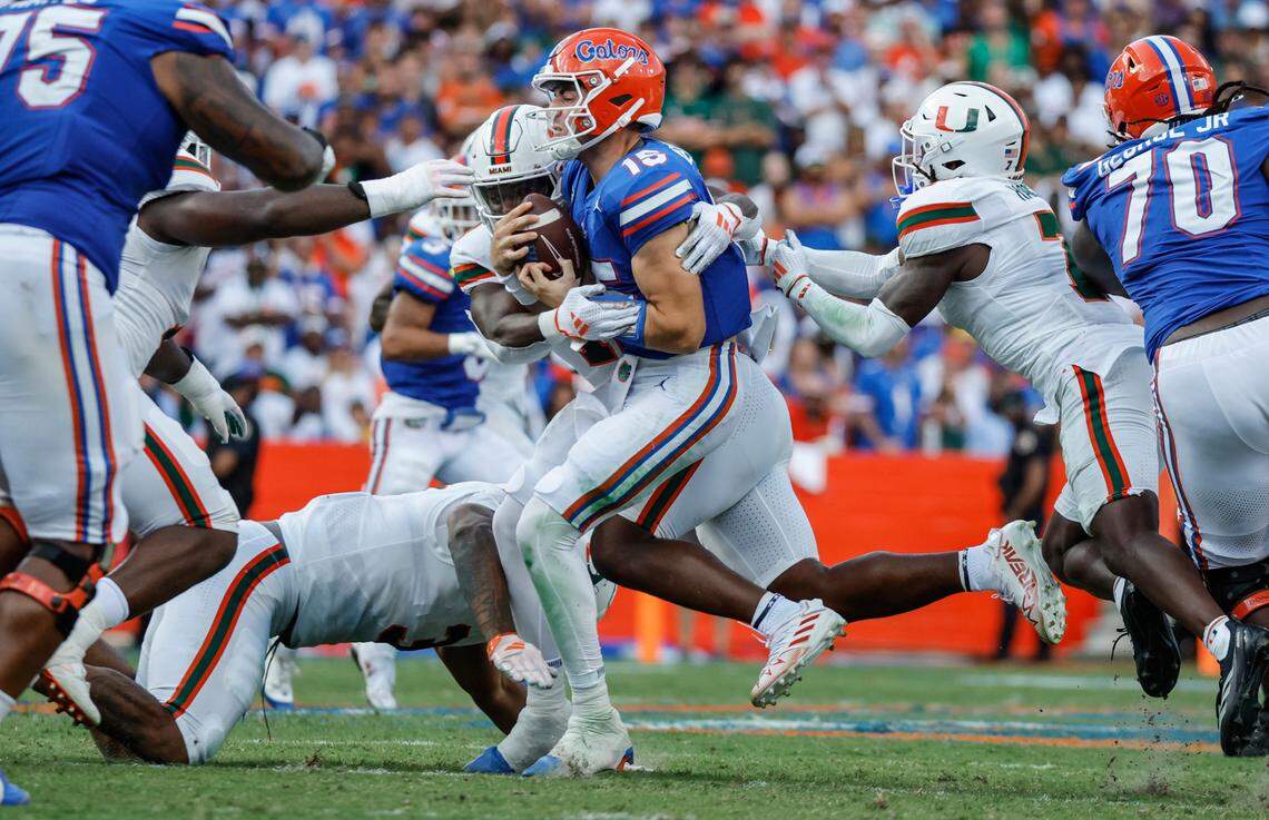 Fllorida Gators quarterback Graham Mertz (15) is sacked by Miami Hurricanes defensive lineman Elijah Alston (11) during the second half of an NCAA college football game at Ben Hill Griffin Stadium in Gainesville, Florida, on Saturday, August 31, 2024.