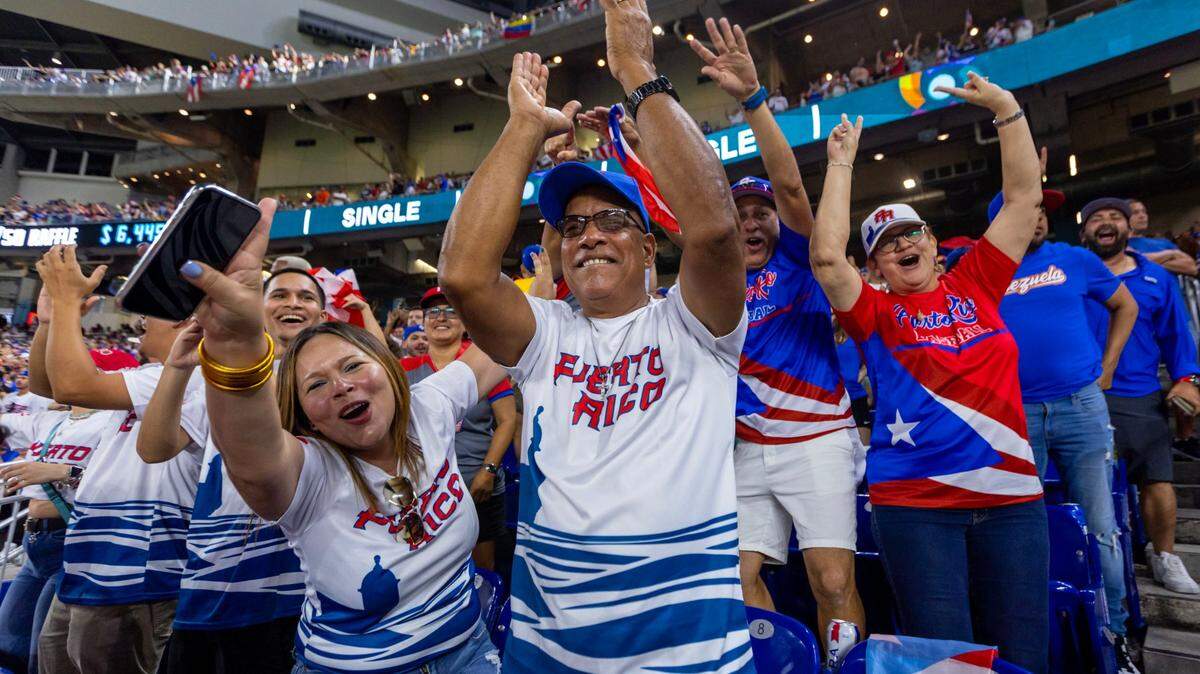 Puerto Rico fans reacts in the stands to a play during the eighth inning of a 2023 World Baseball Classic pool D game against Venezuela at loanDepot Park in Miami, Florida, on Sunday, March 12, 2023.