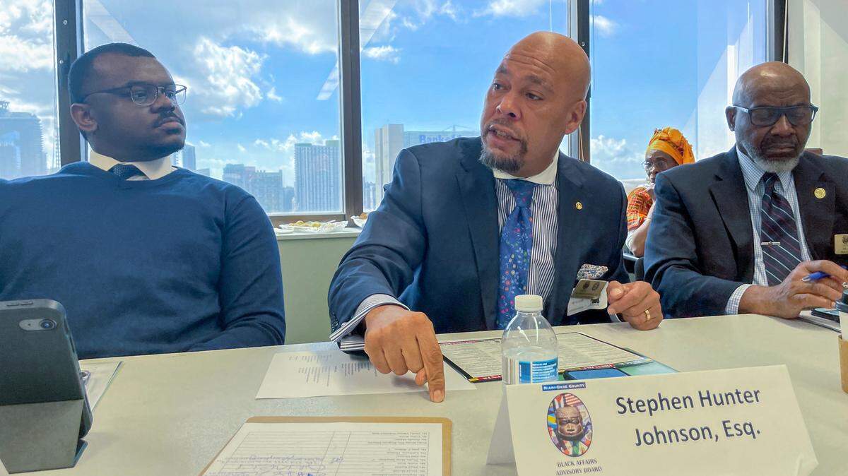 Stephen Hunter Johnson addresses fellow members of Miami-Dade County’s Black Affairs Advisory Board on Wednesday, Feb. 1, 2023. To Johnson’s left is Jihaid Rashid, and to his right is Arbie Nickerson Jr. The board voted unanimously to send a letter to Florida Gov. Ron DeSantis opposing his positions against diversity spending at state schools and the blocking of an African-American studies course the governor condemned as ideological.
