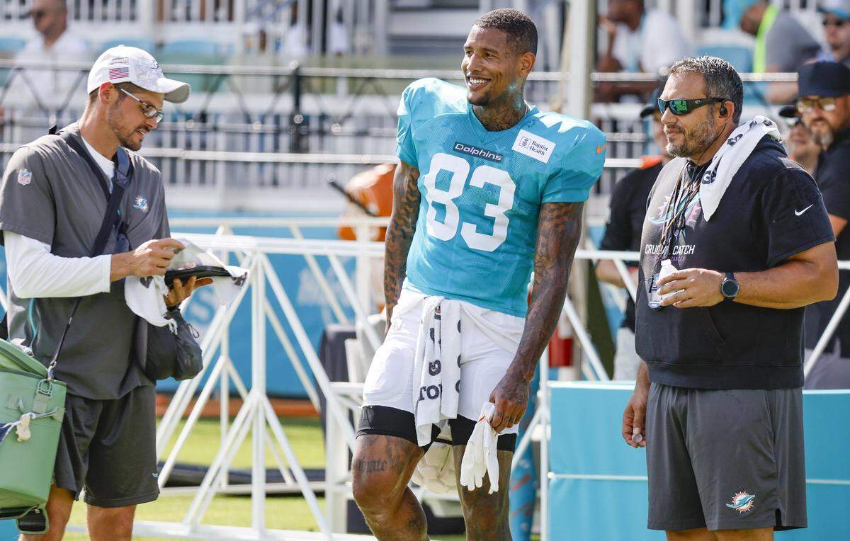 Miami Dolphins tight end Darren Waller (83) reacts during an NFL football joint practice with the Jacksonville Jaguars at the Miami Dolphins Training Camp.