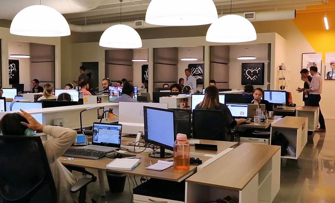 A typical workday inside the headquarters of OnPoint Global, an online content generator/data firm, located at 350 NE 60th Street in Little Haiti.