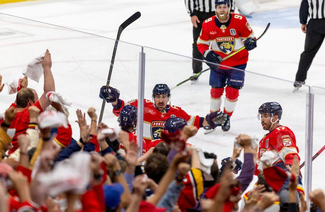 Florida Panthers center Carter Verhaeghe (23) celebrates with teammates Brad Marchand (63), Evan Rodrigues (17), and defenseman Nate Schmidt (88) after scoring a goal against the Edmonton Oilers during the first period of Game 3 in the Stanley Cup Final at Amerant Bank Arena on Monday, June 9, 2025, in Sunrise, Fla.